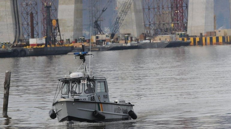 A Westchester police boat on Sunday, March 13, 2016, sails...