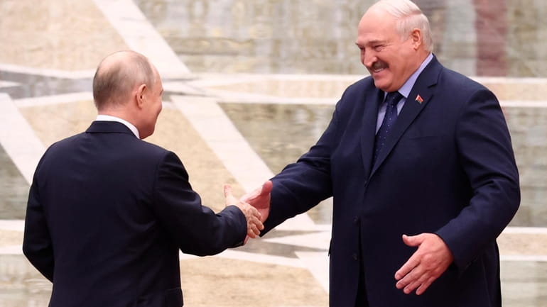 Belarus' President Alexander Lukashenko, right, and Russian President Vladimir Putin...