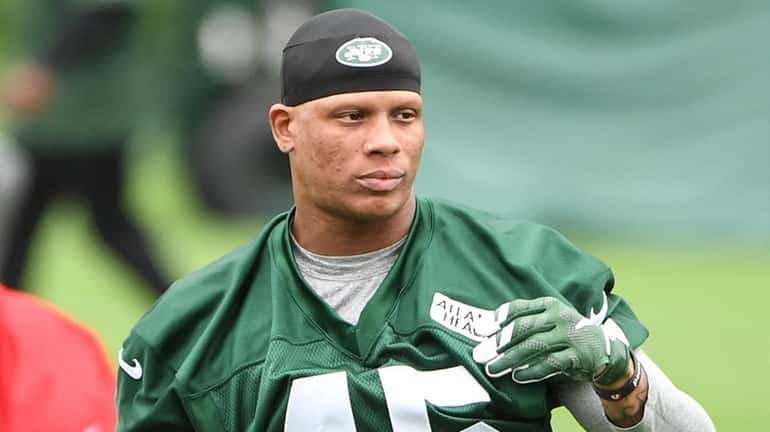 New York Jets free safety Rontez Miles stretches during organized...