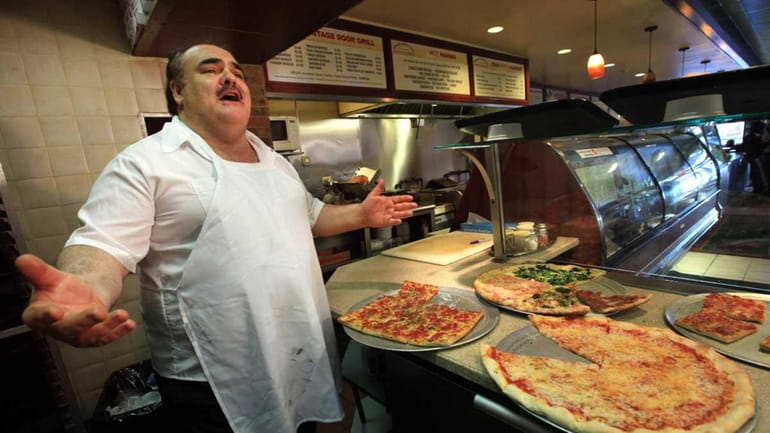 Carmelo Raccuglia, the singing pizza maker, is shown in the...