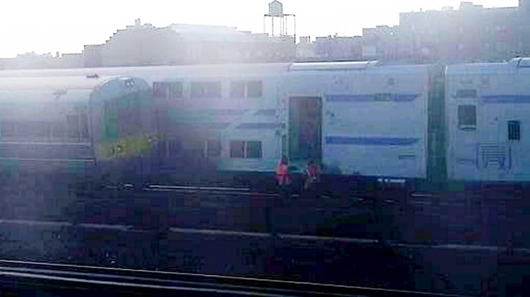A Huntington-bound train sideswiped maintenance equipment and collided with a...