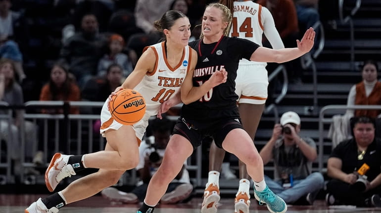 Texas guard Shay Holle, left, drives around Louisville guard Hailey...