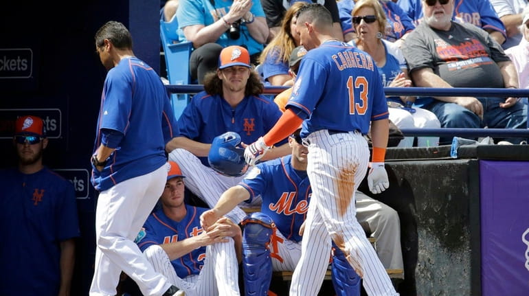 New York Mets' Asdrubal Cabrera leaves during the first inning...