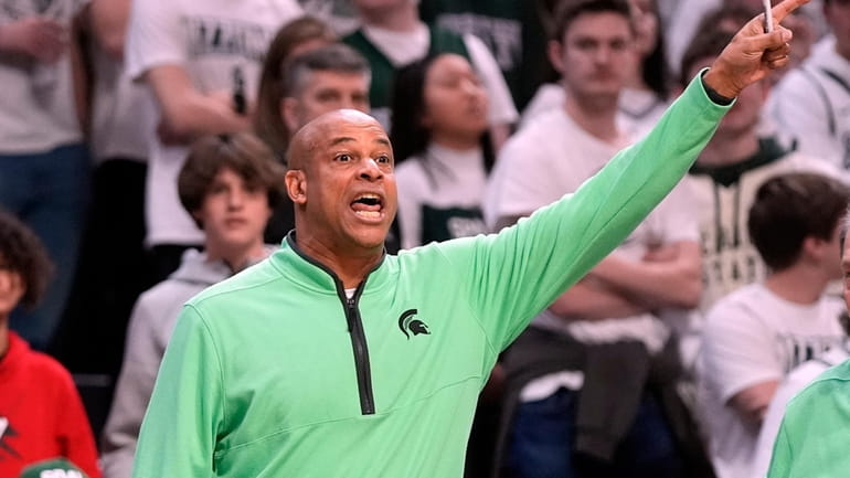 Michigan State assistant oach Mark Montgomery directs the team from...