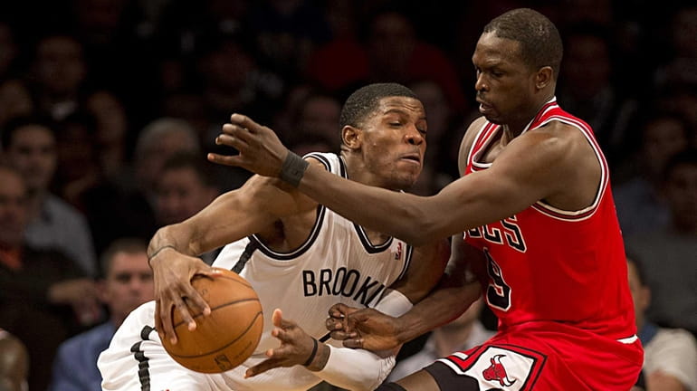 Joe Johnson tries to fight through the defense of the...