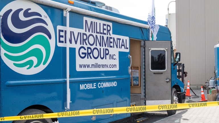 Members of the Miller Environmental Group perform an unrelated cleanup...