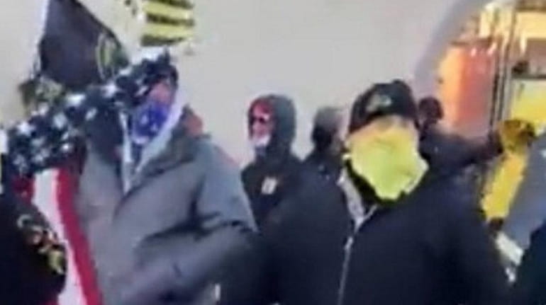 About 20 members of the far-right group the Proud Boys...