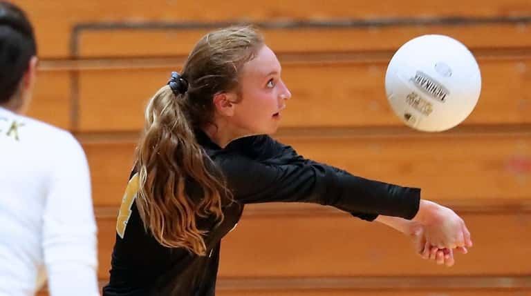 Commack girls volleyball captain Abbey Dummler gets to the outside for...
