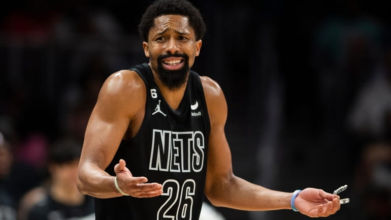 Nets guard Spencer Dinwiddie reacts after foul call during the...