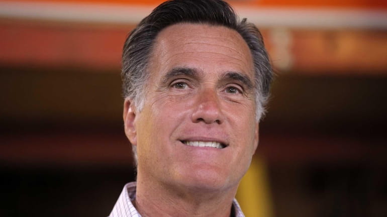 Republican presidential candidate, former Massachusetts Gov. Mitt Romney speaks about...
