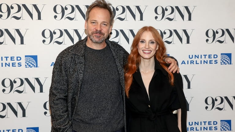 Actors Peter Sarsgaard, left, and Jessica Chastain pose backstage before...