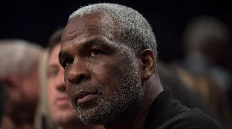Former Knicks player Charles Oakley on the sideline in the...
