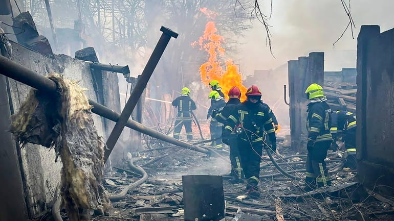 In this photo provided by the Ukrainian Emergency Service, emergency...