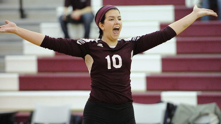 Kings Park's Amanda Gannon reacts after scoring a point on...
