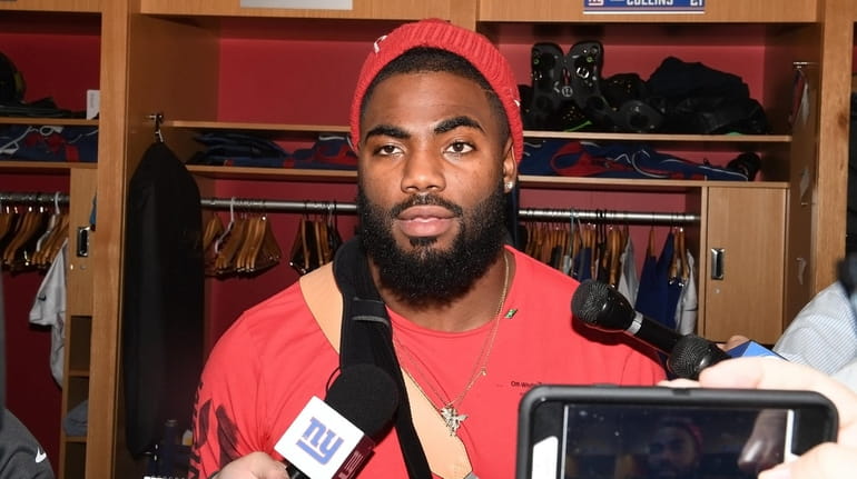 Landon Collins of the Giants speaks to the media during locker...