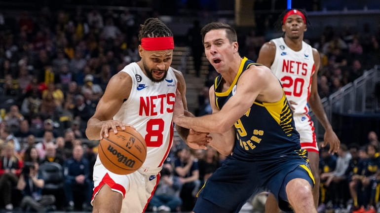 Nets guard Patty Mills (8) drives against Indiana Pacers guard...