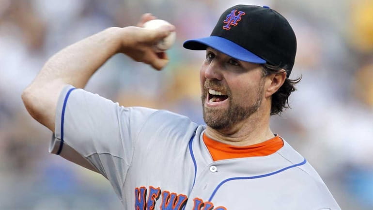 New York Mets starting pitcher R.A. Dickey throws against the...