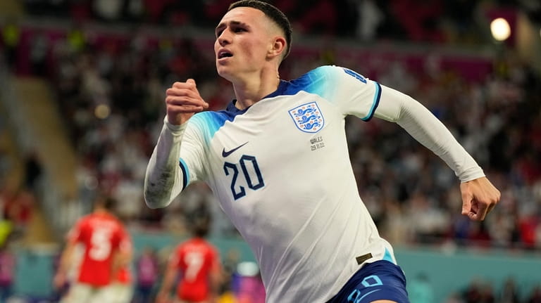England's Phil Foden celebrates after scoring his side's second goal...