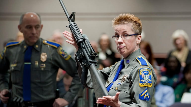 FILE - In this Jan. 28, 2013, file photo, firearms...