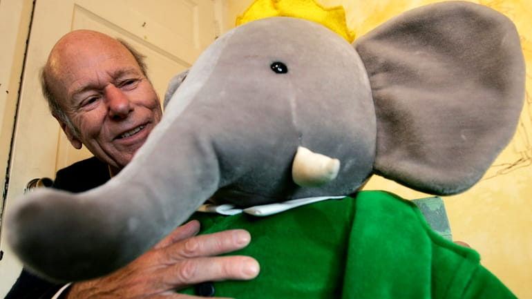Babar author Laurent de Brunhoff poses for a photograph with...