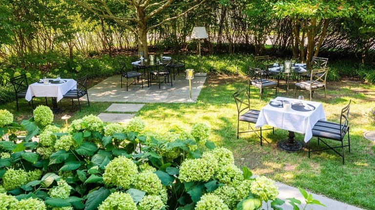 Outdoor dining space at 1770 House in East Hampton.