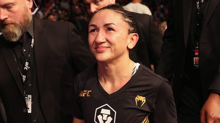 Carla Esparza reacts after her victory over Rose Namajunas (not...