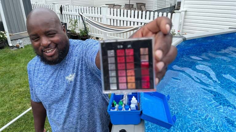 Albert Daniels of Magically Blu Pool & Spa Service holds the results...