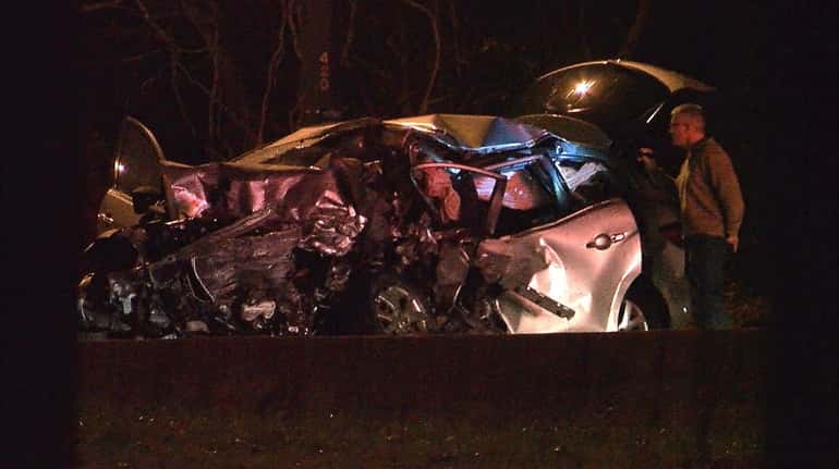 Investigators at the scene of a fatal wrong-way crash on...
