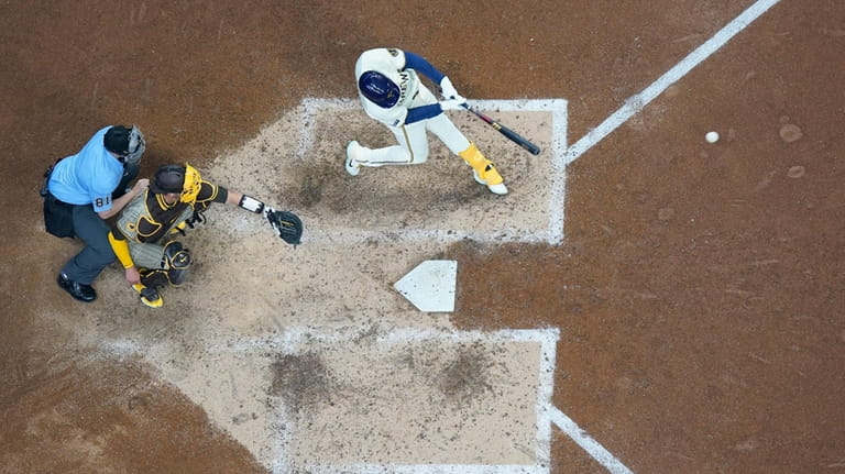 Milwaukee Brewers' Blake Perkins gets an RBI hit during the...