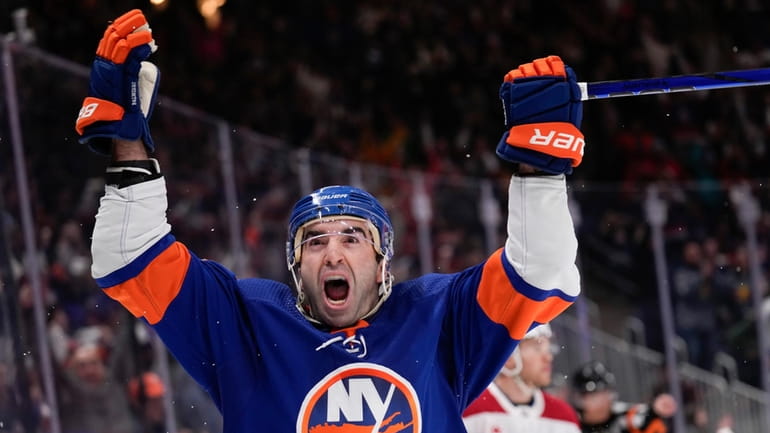 Islanders' Kyle Palmieri reacts after scoring the winning goal during...