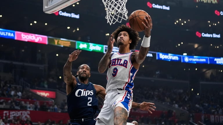 Philadelphia 76ers guard Kelly Oubre Jr. (9) goes up for...