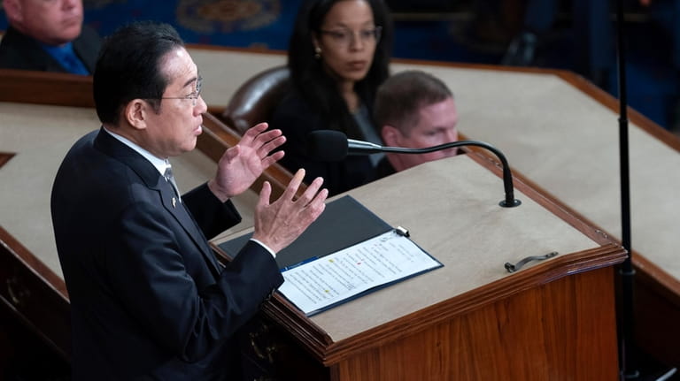 Japan's Prime Minister Fumio Kishida addresses a joint meeting of...