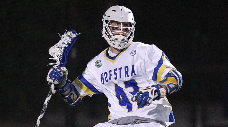 Hofstra's Ryan Tierney moves the ball behind the net against...