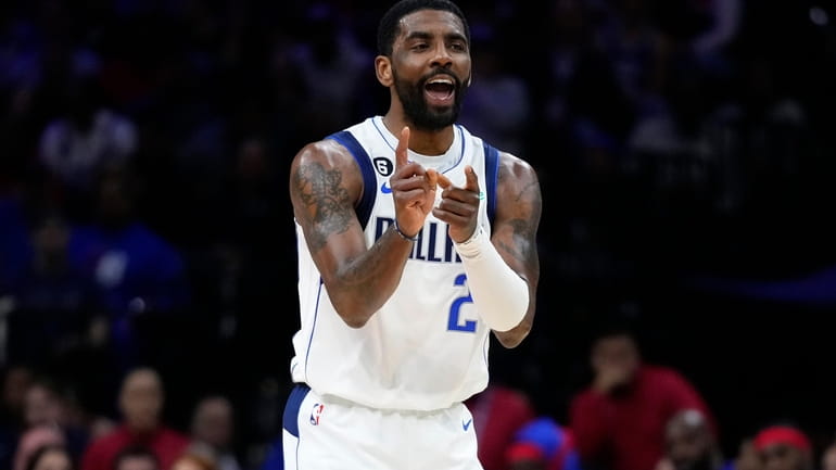 Dallas Mavericks' Kyrie Irving reacts during the first half of...