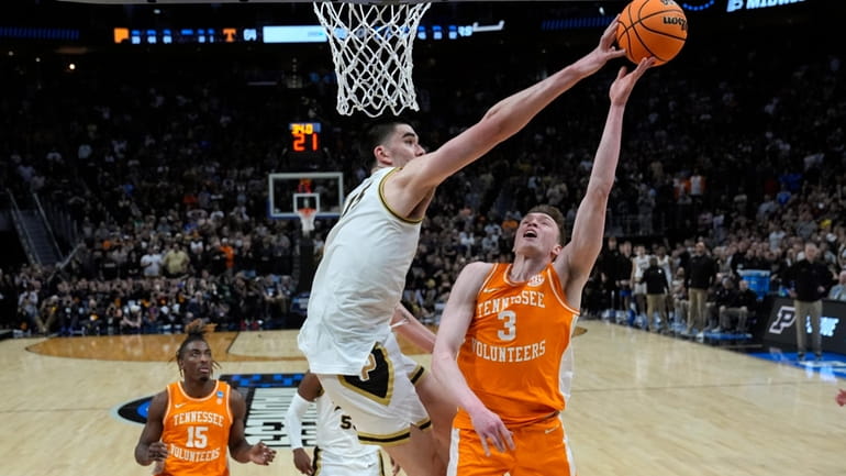 Purdue center Zach Edey (15) blocks a basket attempt by...