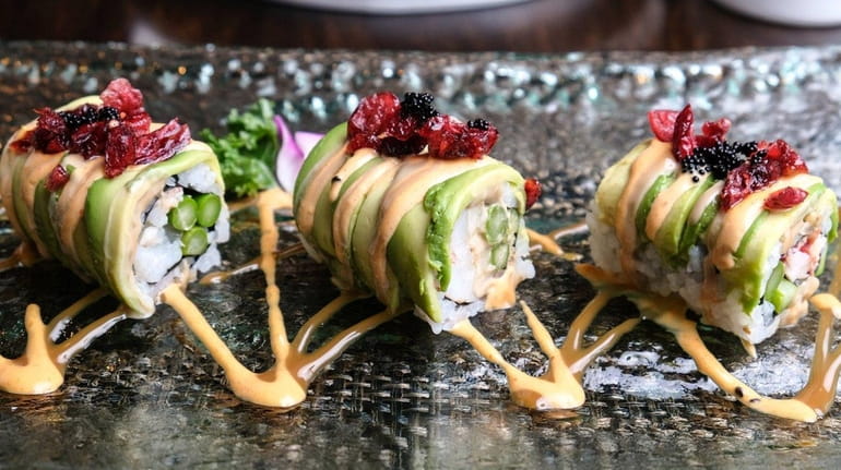 A Black Pearl sushi roll stuffed with asparagus and steamed...