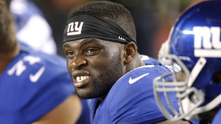 New York Giants defensive end Owamagbe Odighizuwa reacts on the...