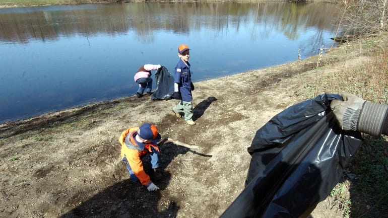 Many Long Islanders, including local scouts, commemorate Earth Day by...