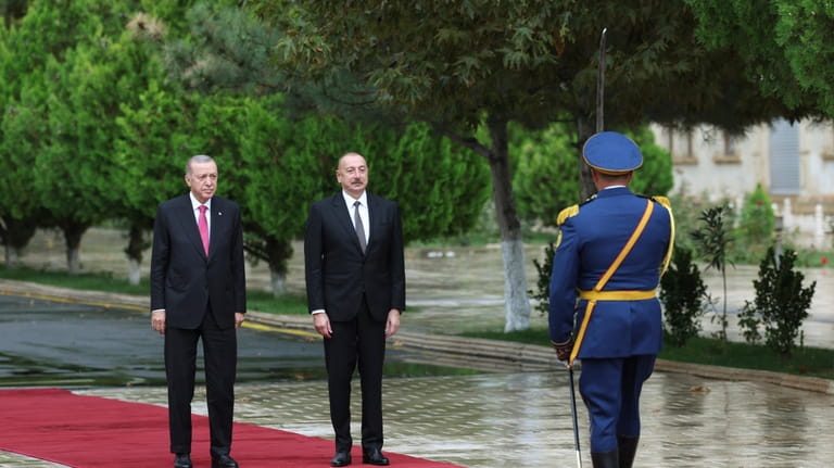 In this handout photo released by Turkish Presidency, Azerbaijan's President...