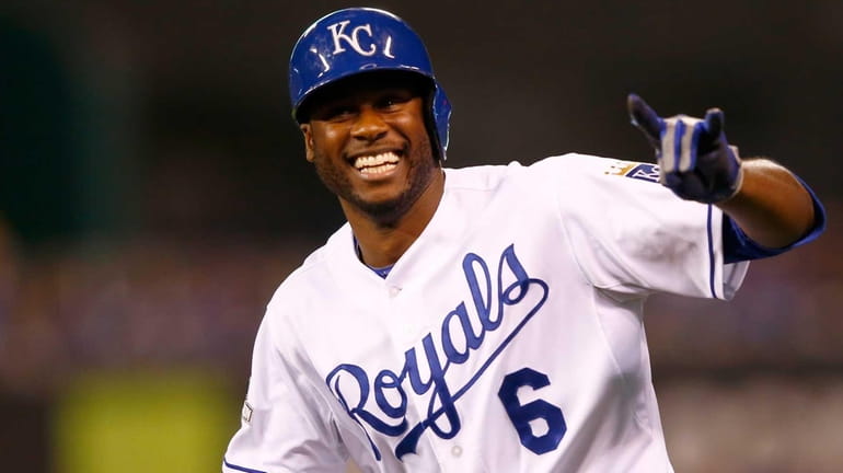 Lorenzo Cain of the Kansas City Royals reacts after reaching...