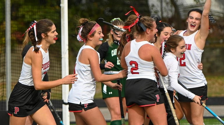 Pierson players celebrate after Caroline Canavan scored during the Long Island Class...