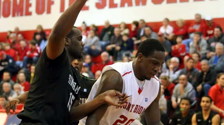 Stony Brook's Jameel Warney moves the ball down low against...