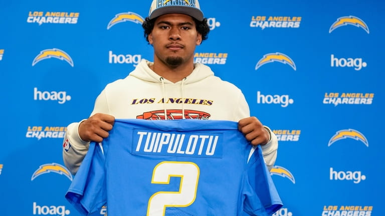 USC linebacker Tuli Tuipulotu, selected in the second round of...