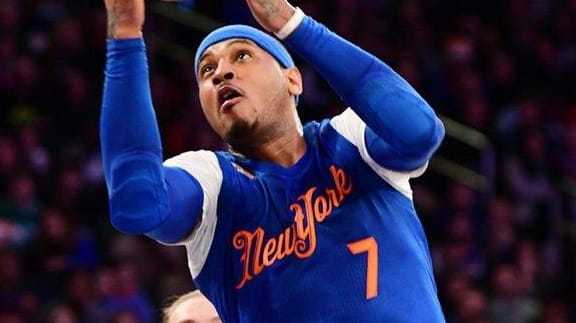 Carmelo Anthony of the Knicks drives to the basket past...