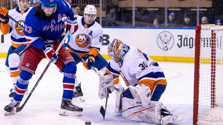 Islanders goaltender Ilya Sorokin (30) blocks a shot by Rangers...