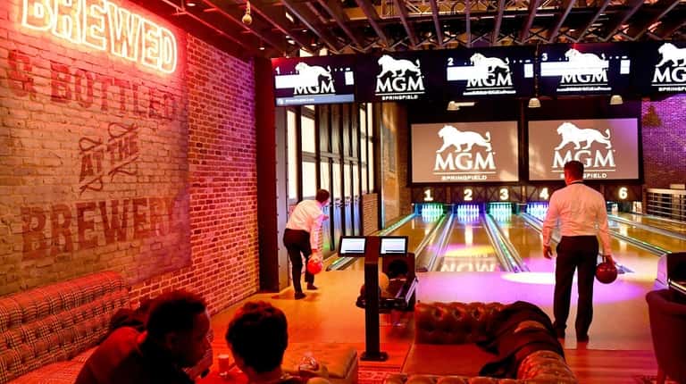 Guests bowling at the TAP Arcade & Bowling at MGM Springfield...