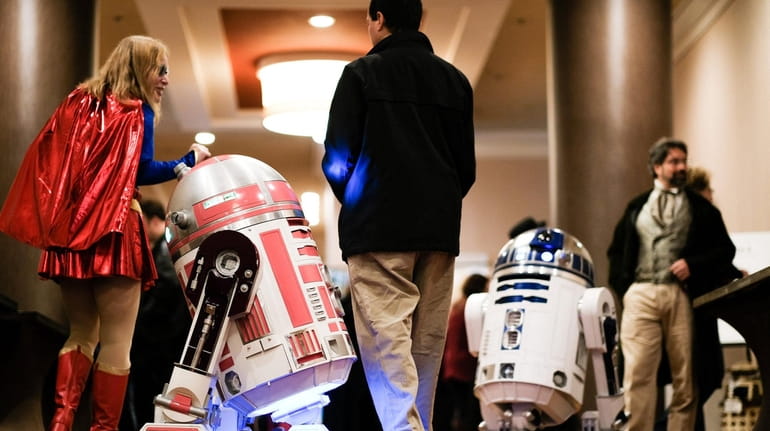 R2-D2s from "Star Wars" roam the Long Island Geek Convention...