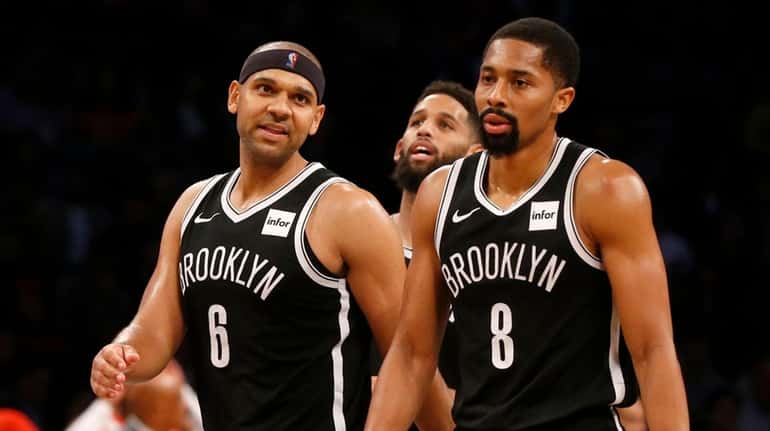 Jared Dudley #6 and Spencer Dinwiddie #8 of the Brooklyn...