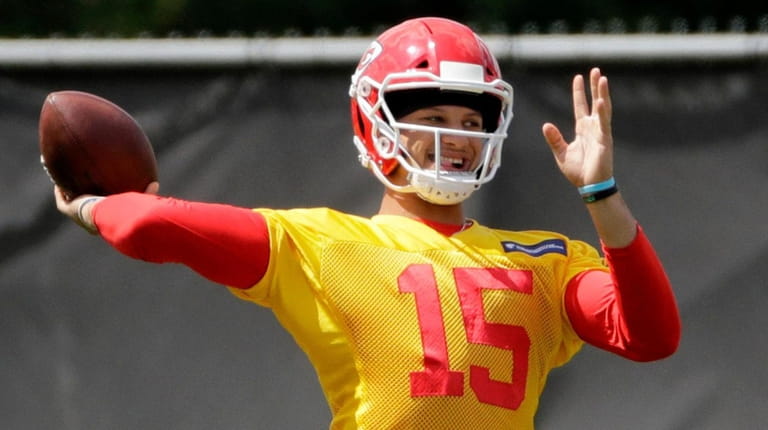 Chiefs quarterback Patrick Mahomes throws during a workout at the...