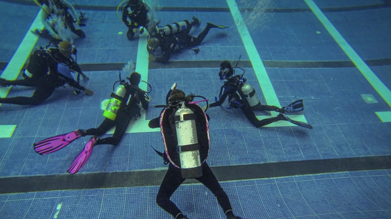 Divers underwater during a Scuba Network of Long Island certification class...